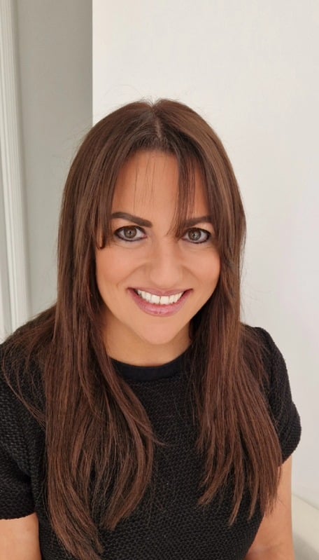Cheryl Phillips, hair loss specialist, smiling in her Macclesfield studio